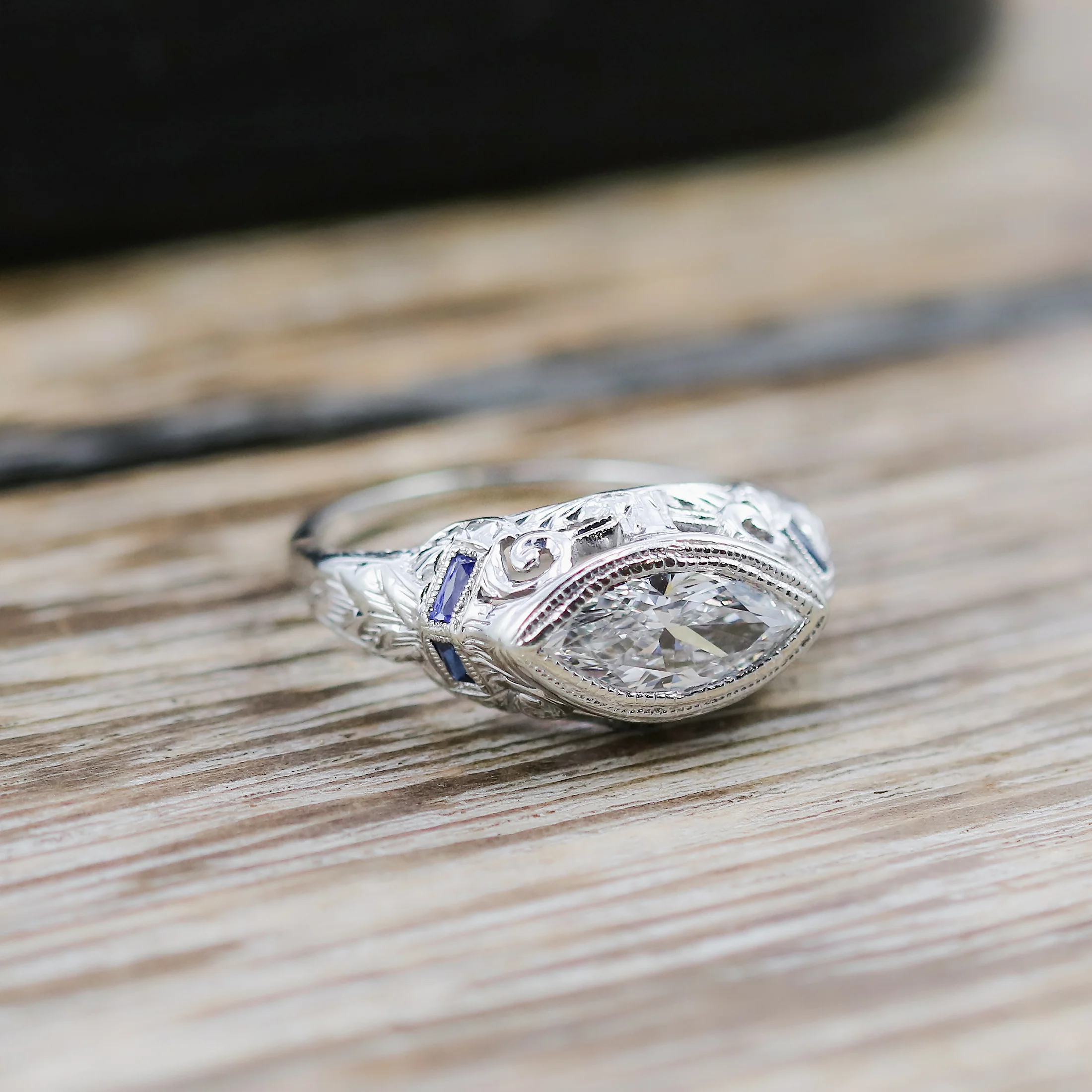Art Deco 18kt white gold and sapphire mounting holding a modern .83 carat marquise shaped diamond - Image 3