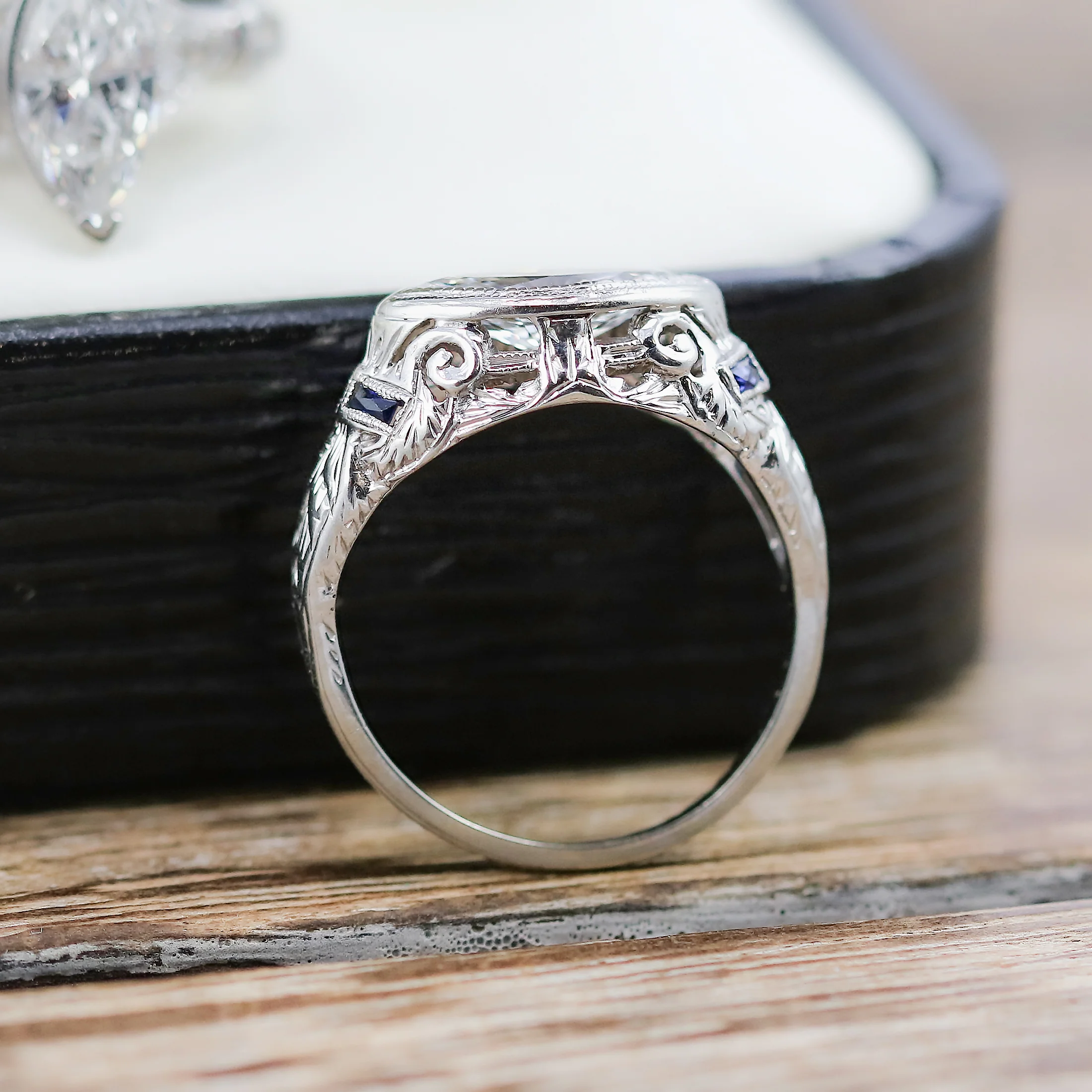 Art Deco 18kt white gold and sapphire mounting holding a modern .83 carat marquise shaped diamond - Image 4